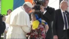 Pope Francis embraces two girls with Down Syndrome